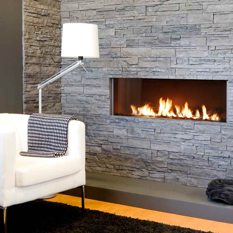 Element4 Modore140 Installed at the Living room with Ceramic Glass, Black Mesh Safety Screen plus ceramic fire bed with heat-resistant ceramic fibers Logs set