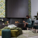 SUMMUM 100 C installed at Living room with a lovely lady relaxing plus Real Flame Burner with True-to-Nature Wood Logs