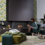 SUMMUM 100 C installed at Living room with a lovely lady relaxing plus Real Flame Burner with True-to-Nature Wood Logs